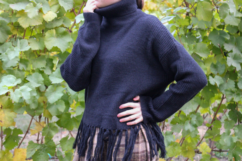 Coastline Fringe Hem Ribbed Turtleneck Sweater